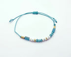 Pulsera de piedras naturales turquesa y coral con baño de oro amarillo