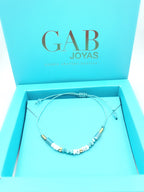 Pulsera de piedras naturales turquesa y coral con baño de oro amarillo