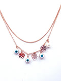 Collar flores y ojo turco baño oro rosado